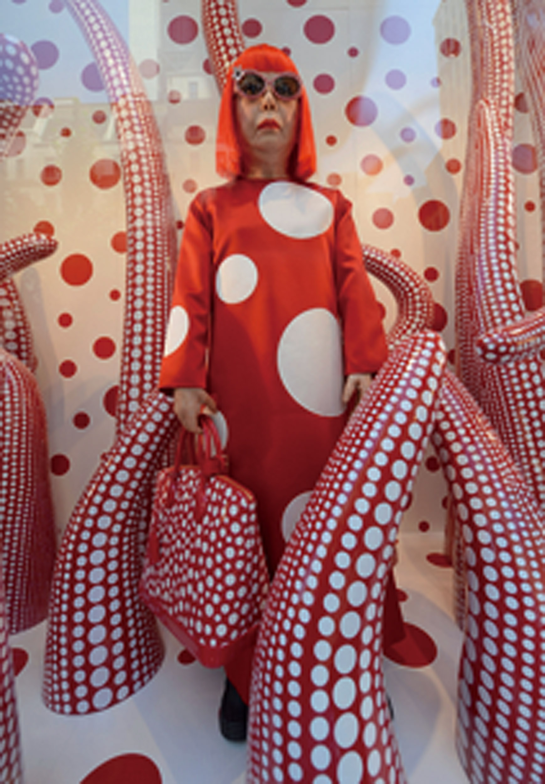 NEW YORK, NY - JULY 10: A wax figure of artist Yayoi Kusama on display during the Louis Vuitton And Yayoi Kusama Collaboration Unveiling at Louis Vuitton Maison on July 10, 2012 in New York City. (Photo by Dimitrios Kambouris/WireImage)